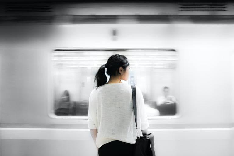 Woman waiting for a train