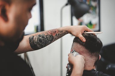 Barber performing a haircut